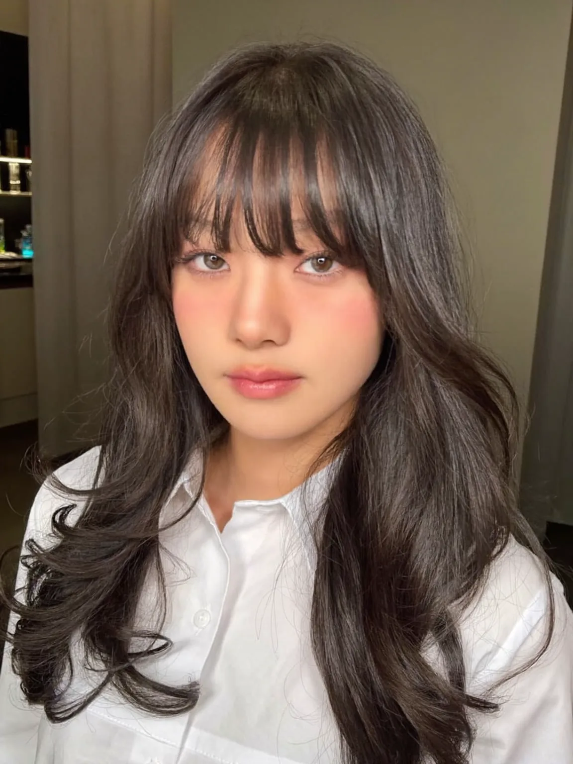 Long Voluminous Chocolate Brown Wavy Layers with Blunt Bangs